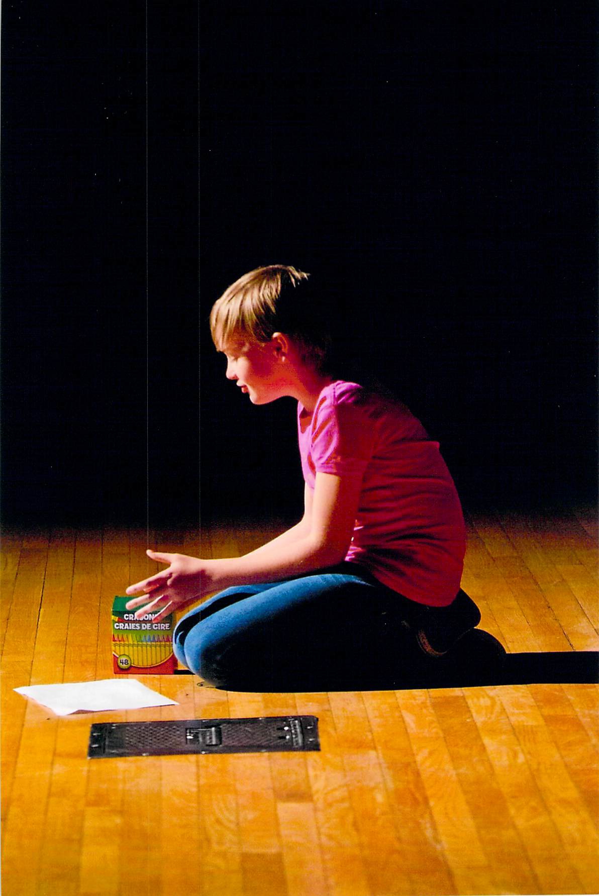 Child Coloring on Stage