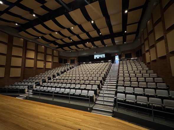 The redesigned seating for the theater with increased seat size, extra leg room, and new guard rails for stair safety. 