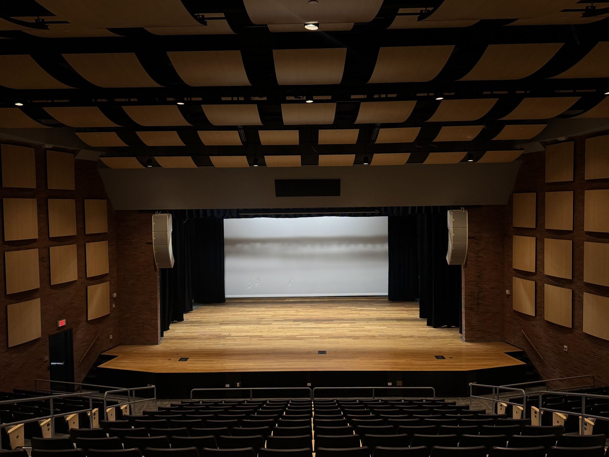 The updated stage with new speakers, sound accoustic improvements, refurbished flooring, and both physical and digital background options