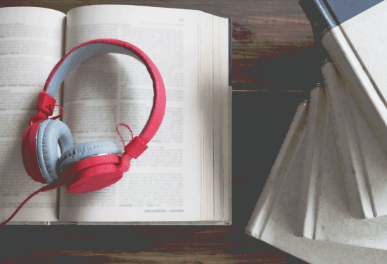 red-headphones-on-top-of-open-book