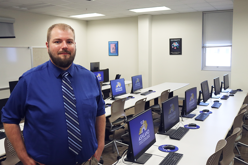 john-hannah-posing-in-front-of-computers