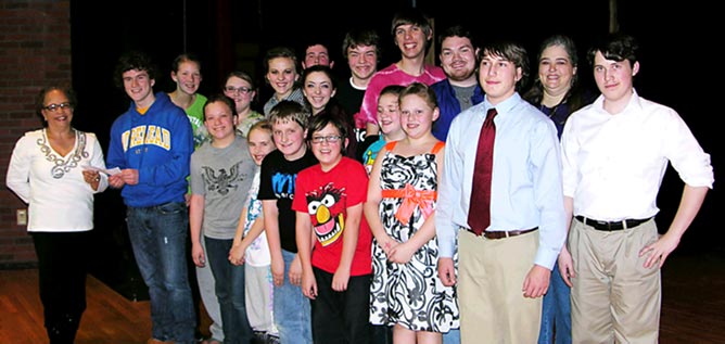 Cast of Joseph and the Amazing Technicolor Dreamcoat smile after winning first place in the Adult competition at the 