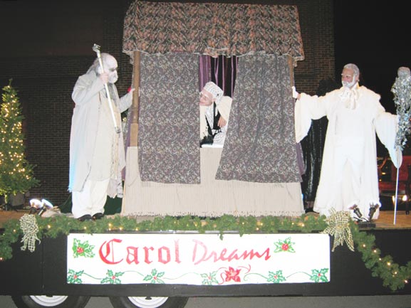 Marley, Scrooge and the Ghost of Christmas Past on the ACTC float.