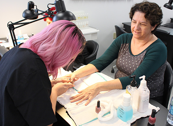 Regina Miller getting a manicure in the ACTC salon
