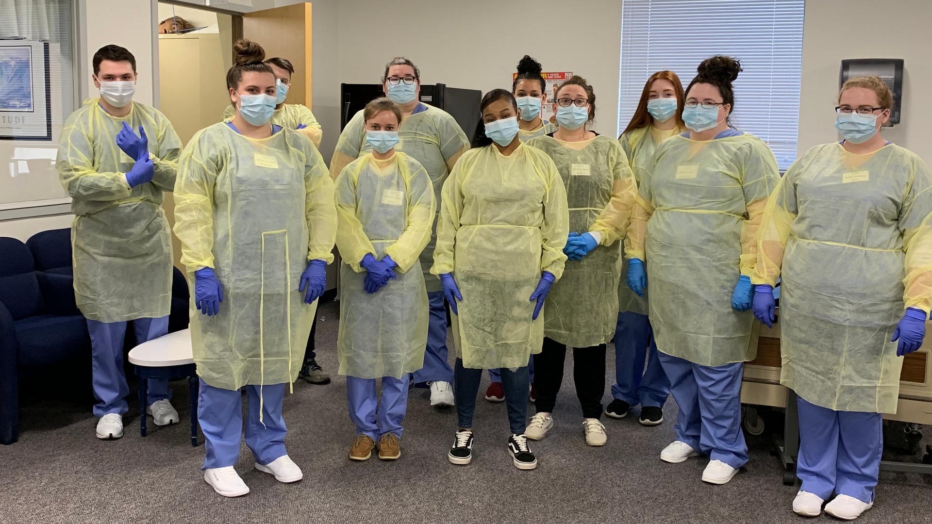 nurse-aides-with-ppe-pose-for-photo