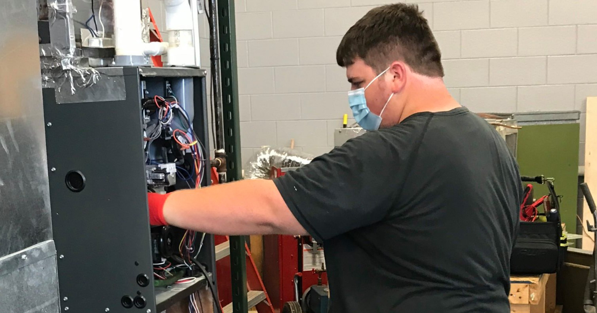 student working on an air unit